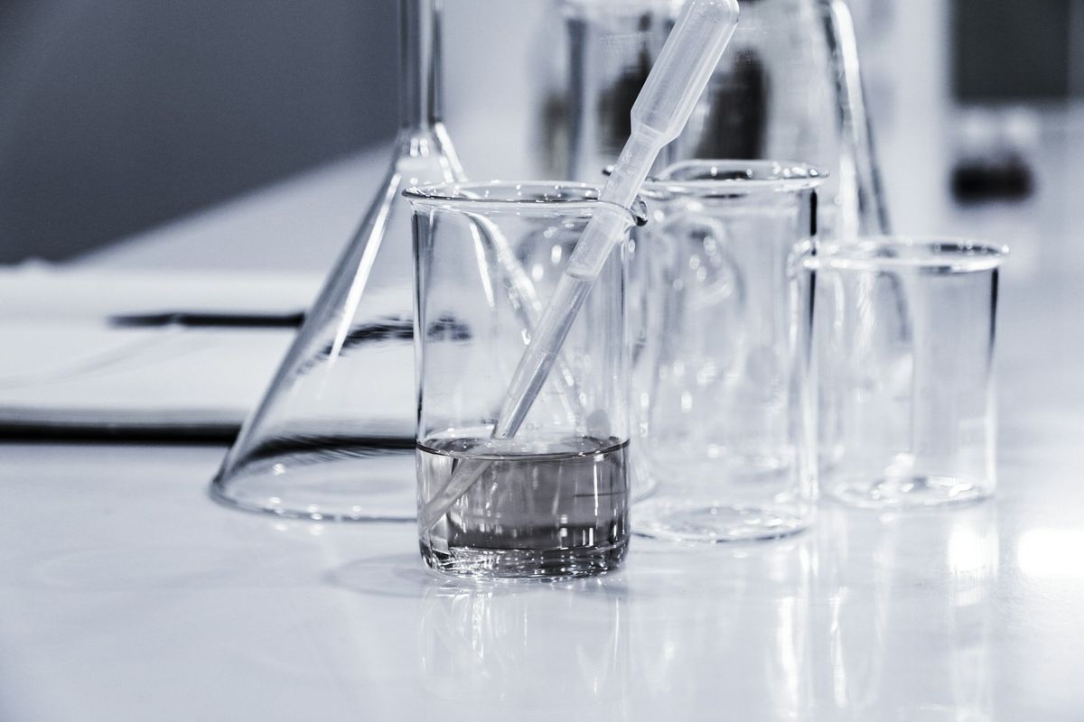 Laboratory glassware with a pipette in a beaker